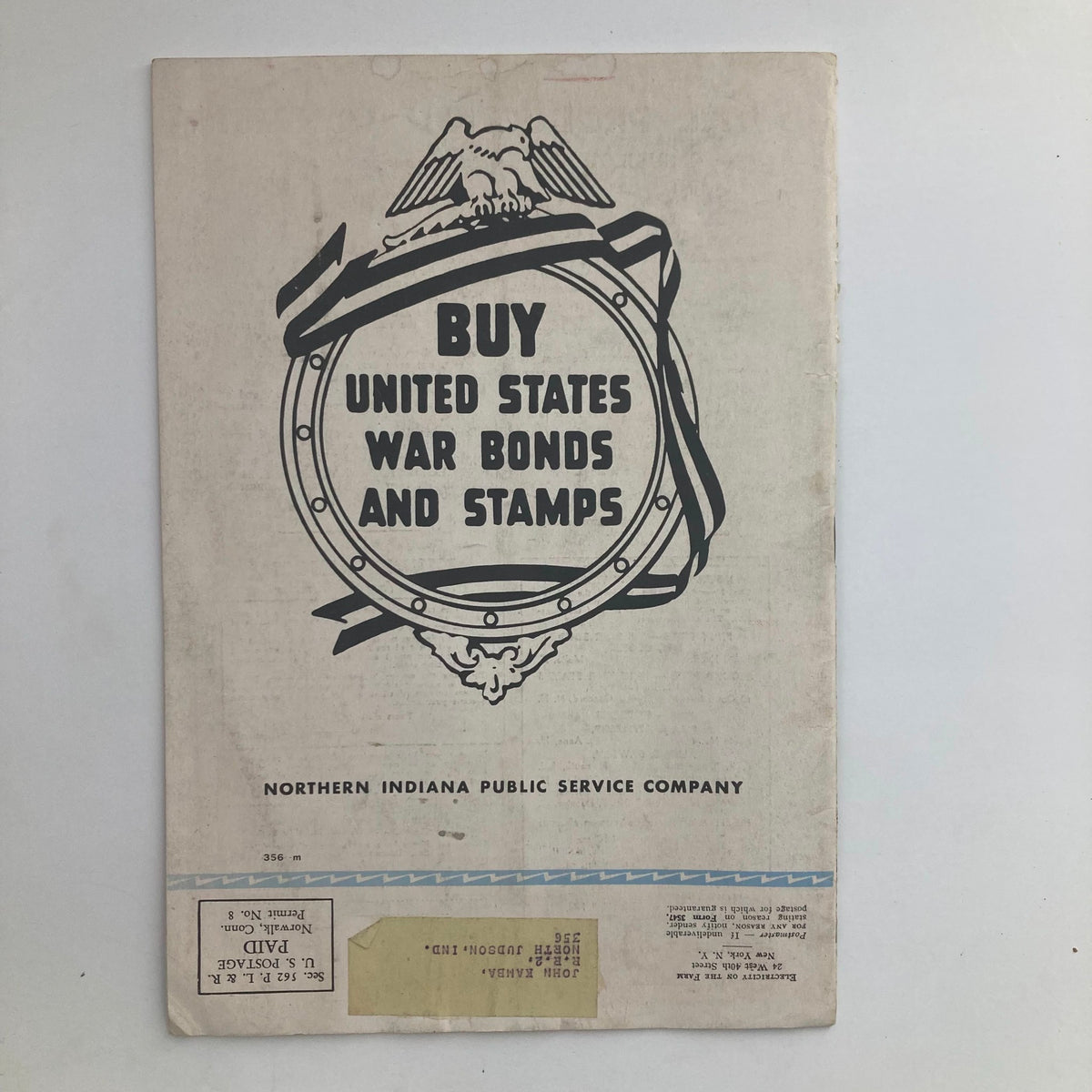 Back cover of VTG Electricity on the Farm Magazine January 1943, promoting the purchase of United States War Bonds and Stamps, emphasizing wartime support.
