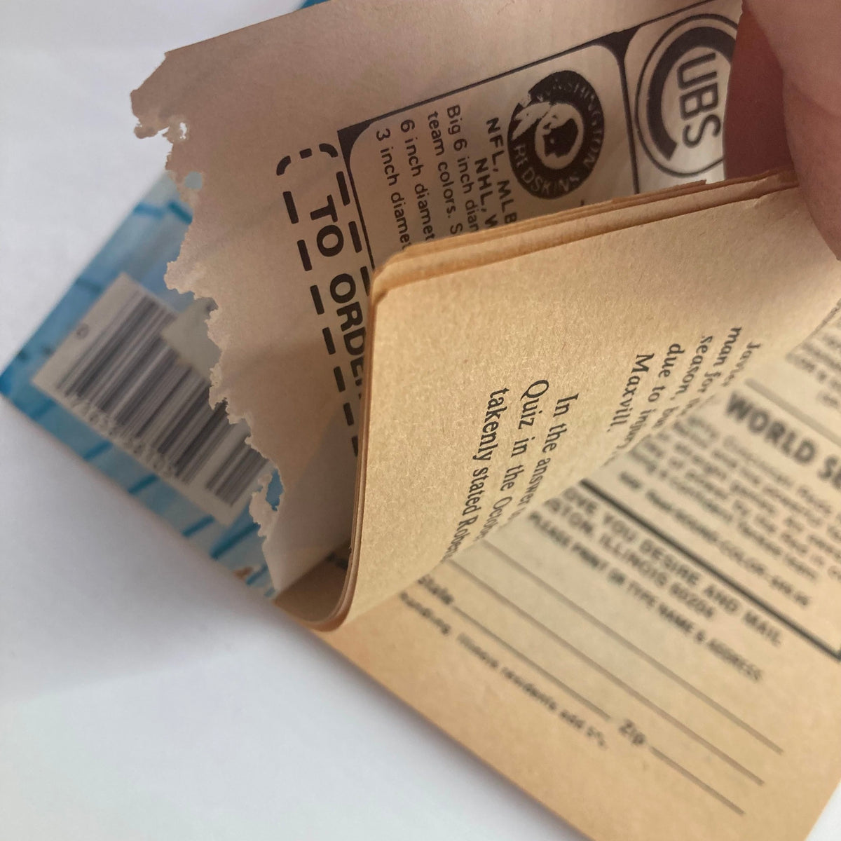 Close-up image showing the torn edge of a page in the VTG Baseball Digest Magazine January 1978 featuring Reggie Jackson, highlighting the vintage magazine's unique wear and tear.