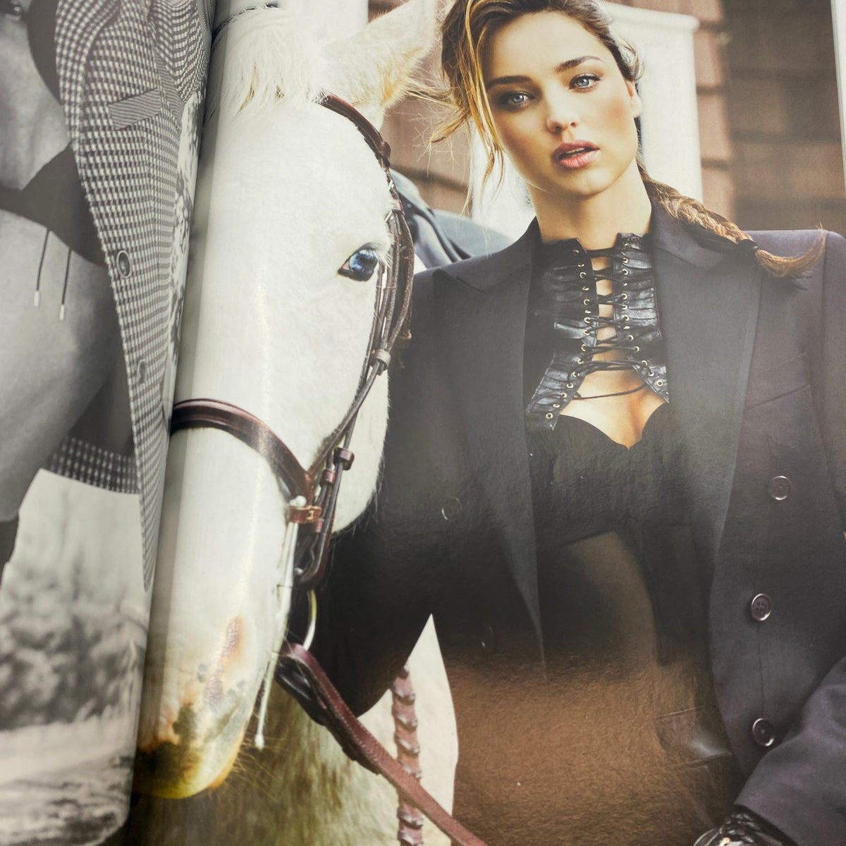 Interior fashion spread from Harper's Bazaar UK Magazine August 2012 featuring Miranda Kerr alongside a horse, emphasizing high fashion.