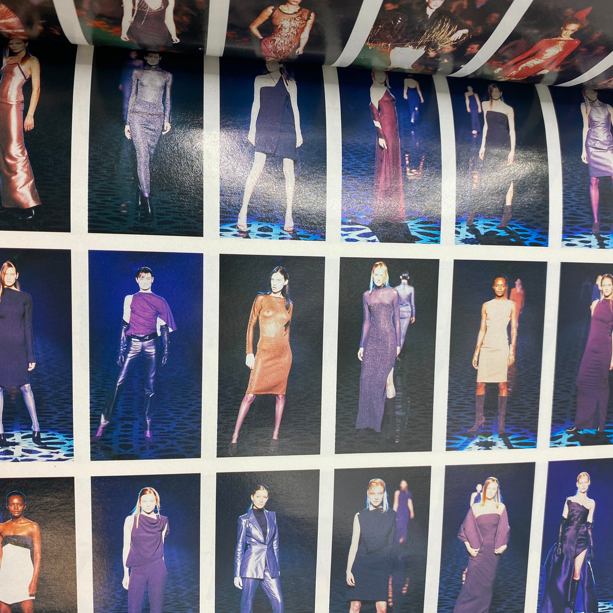 Vogue Italia Magazine July 1998 depicting striking runway looks with models donning glamorous dresses and bold fashion statements in a vibrant setting.