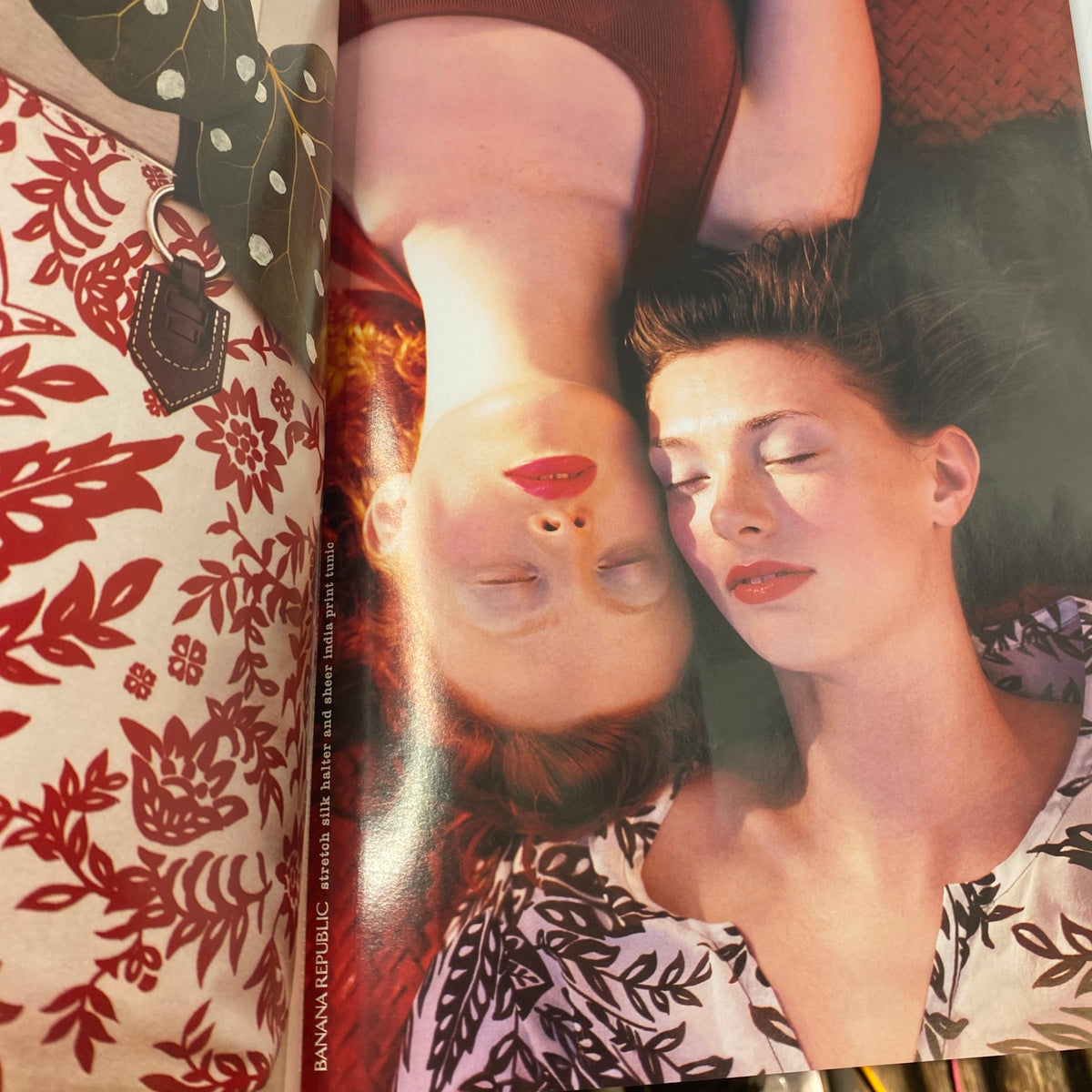 Vogue Magazine June 2003 Reese Witherspoon Cover No Label VG featuring two women with closed eyes lying on a floral-patterned background, emphasizing beauty and serenity.