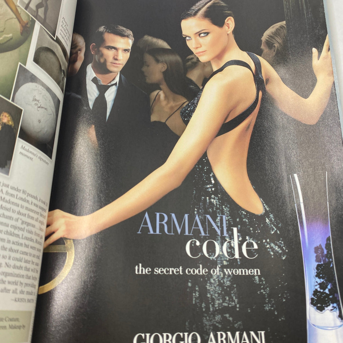 Advertisement for Armani Code in Vanity Fair Magazine May 2008, featuring a striking model and emphasizing luxury and allure.