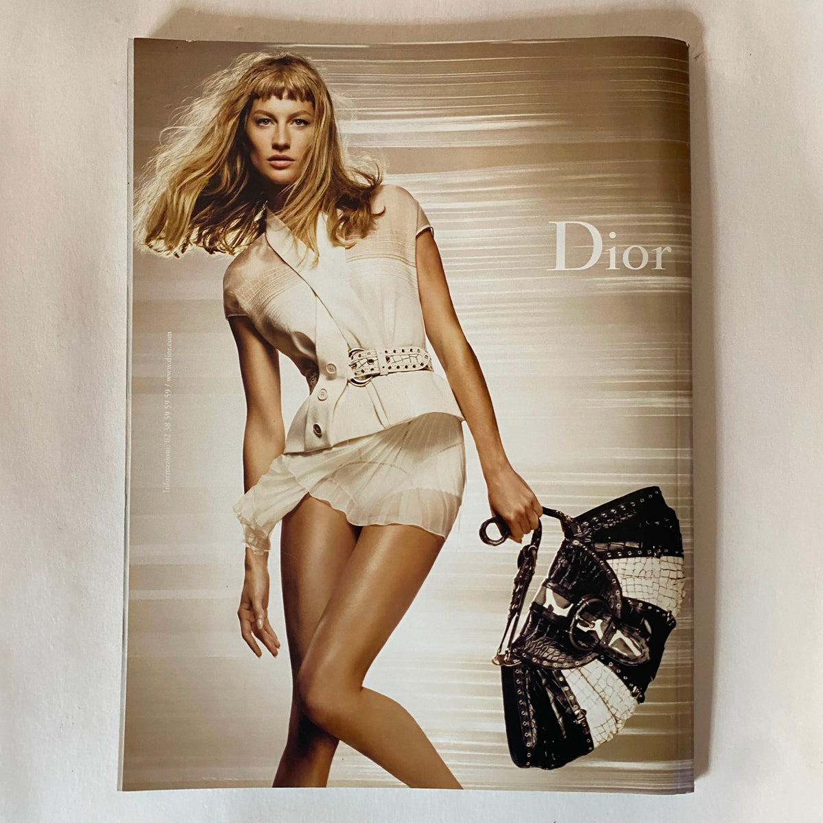 Advertisement page in Vogue Italia March 2009 showcasing a Dior fashion ensemble, highlighting contemporary design and luxury fashion.