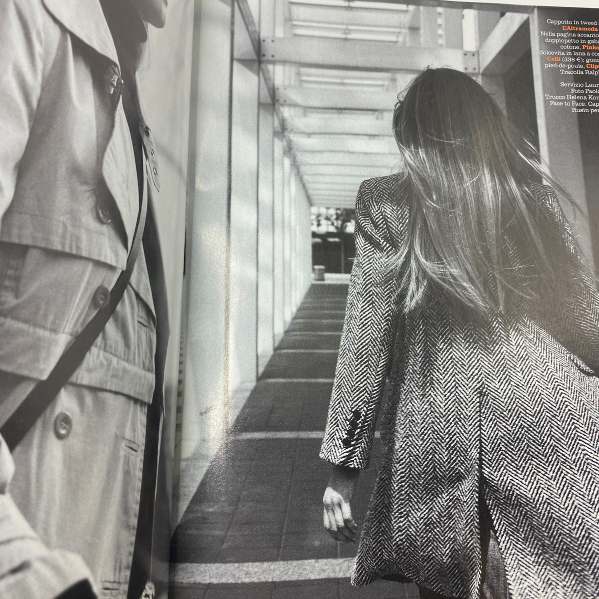 Black and white image from Marie Claire Italia Magazine September 2003 displaying fashion models in stylish outerwear walking through an urban setting.