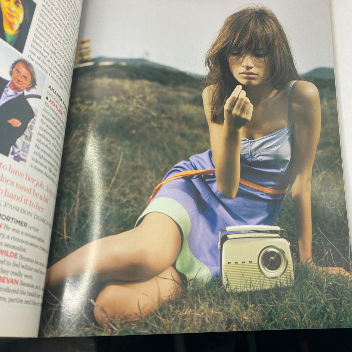 Model in a purple dress sitting on grass, holding a flower, featured in Vogue UK Magazine April 2004 Lily Cole, Gemma Ward Cover No Label VG.