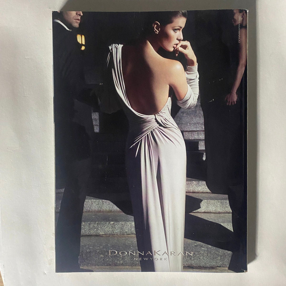 Back cover of Harper's Bazaar October 2011 featuring a glamorous image of a backless Donna Karan dress.