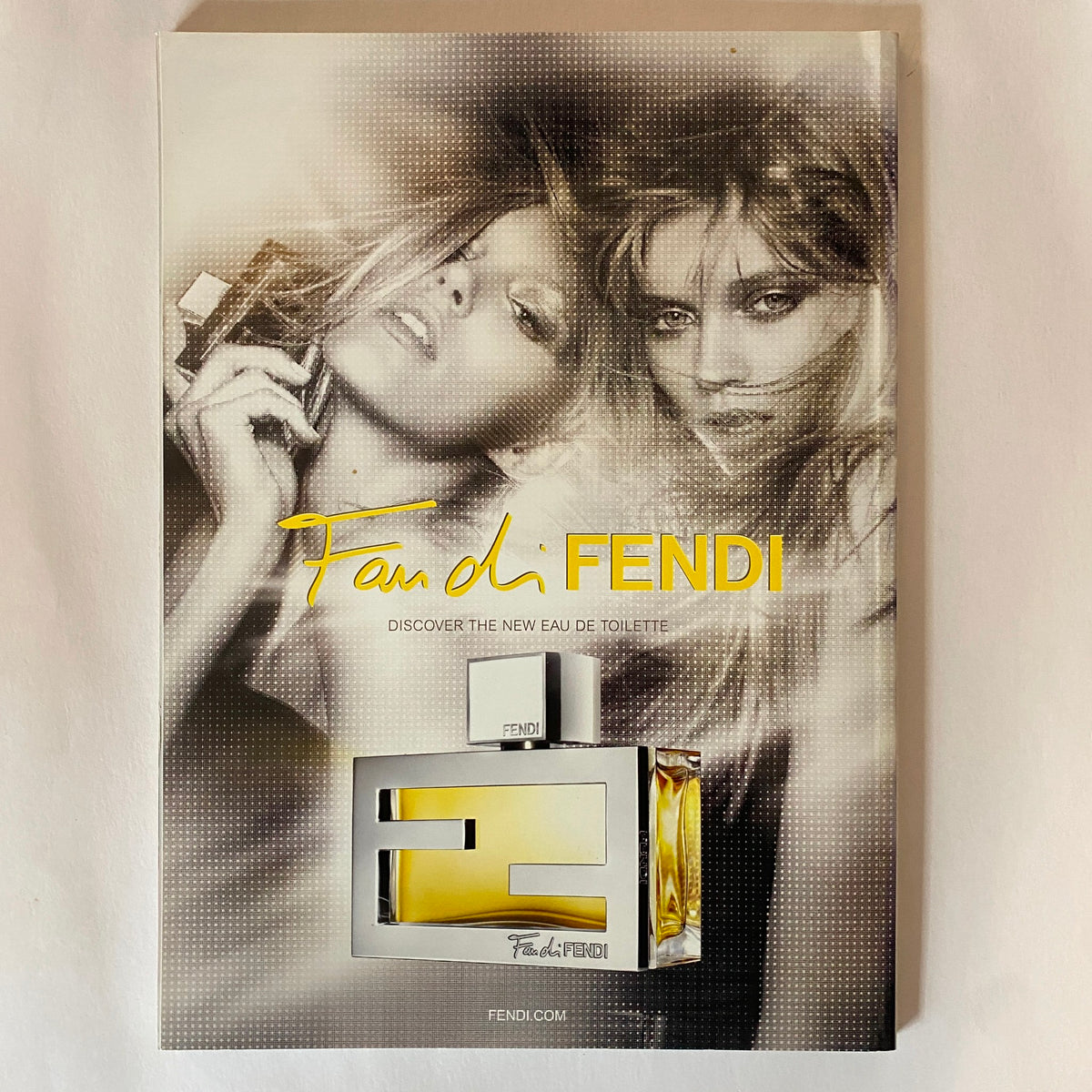 Promotional page from Harper's Bazaar Australia Magazine August 2011 for Fendi fragrance, featuring striking images of models and the product 'Fan di Fendi'.
