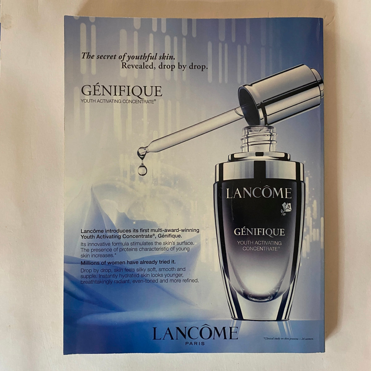 Ad page from Vogue UK Magazine March 2011 for Lancôme Généfique Youth Activating Concentrate, highlighting youth skin care benefits.