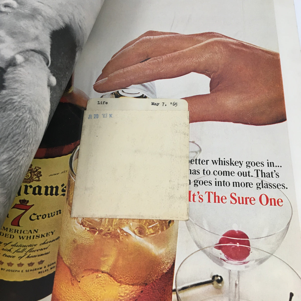 Inside page of VTG Life Magazine May 7 1965 showing an advertisement for whiskey, complete with a hand pouring a drink, alongside the issue's identification.
