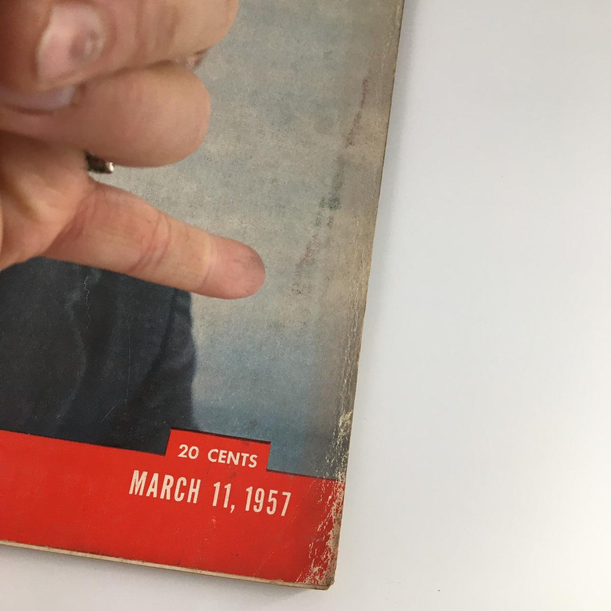 Close-up of the cover of the March 11, 1957 Life Magazine, showcasing Senator John F. Kennedy, with visible price tag and publication date, emphasizing its vintage quality.