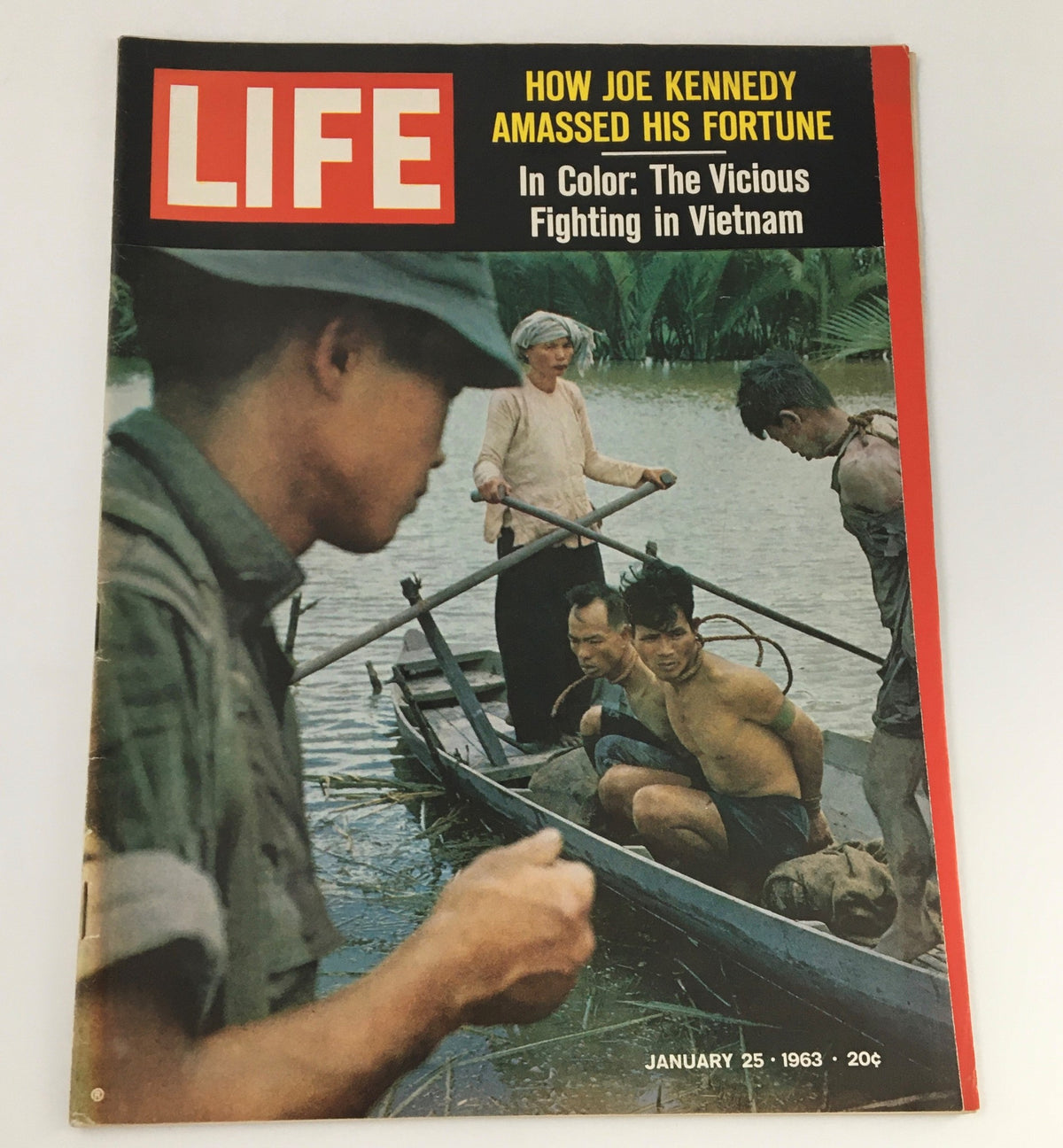 VTG Life Magazine January 25 1963 cover featuring an image of soldiers and captured individuals during the Vietnam War, showcasing the theme of vicious fighting in Vietnam.