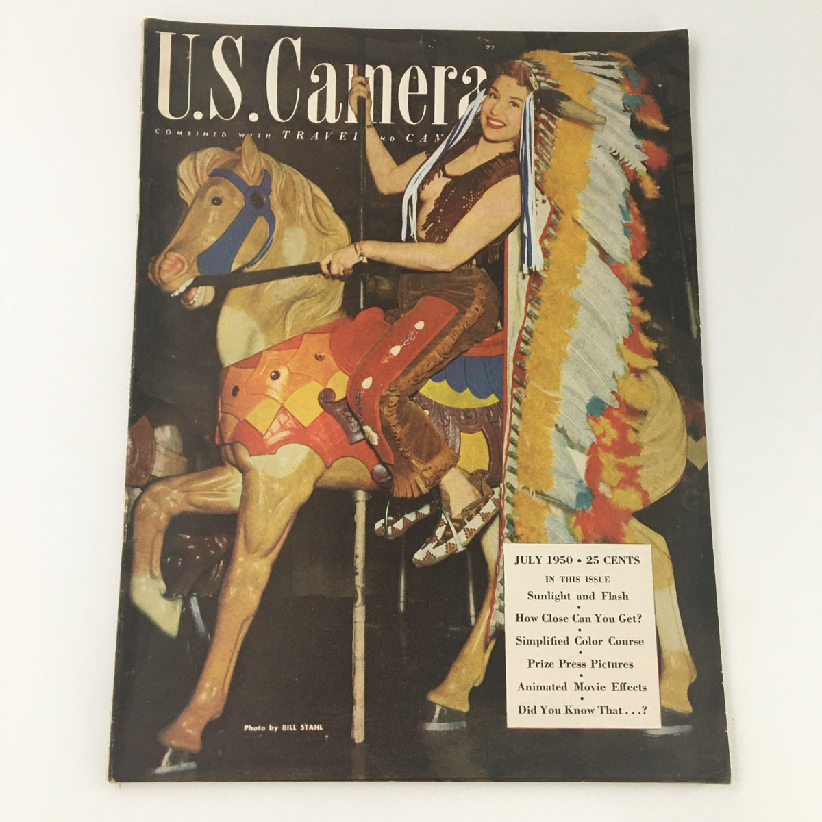 Cover of the VTG U.S. Camera Magazine July 1950 featuring a woman riding a carousel horse, showcasing vibrant colors, and highlighting articles on sunlight and flash, animated movie effects, and photography. A historical collectible item.