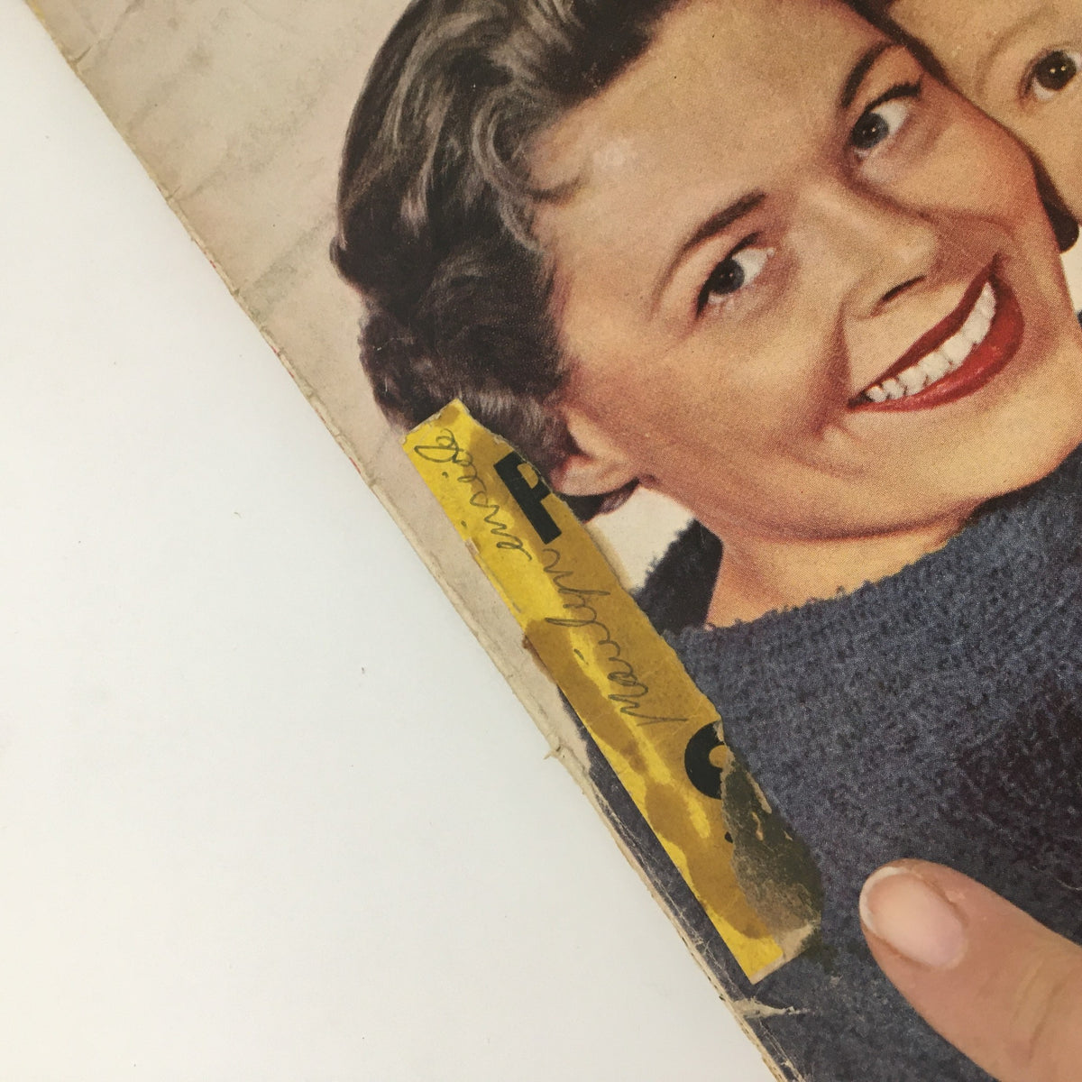 Close-up of the VTG Motion Picture Magazine April 1959 cover featuring Dick Clark and family, showcasing minor wear and a visible marking on the edge.