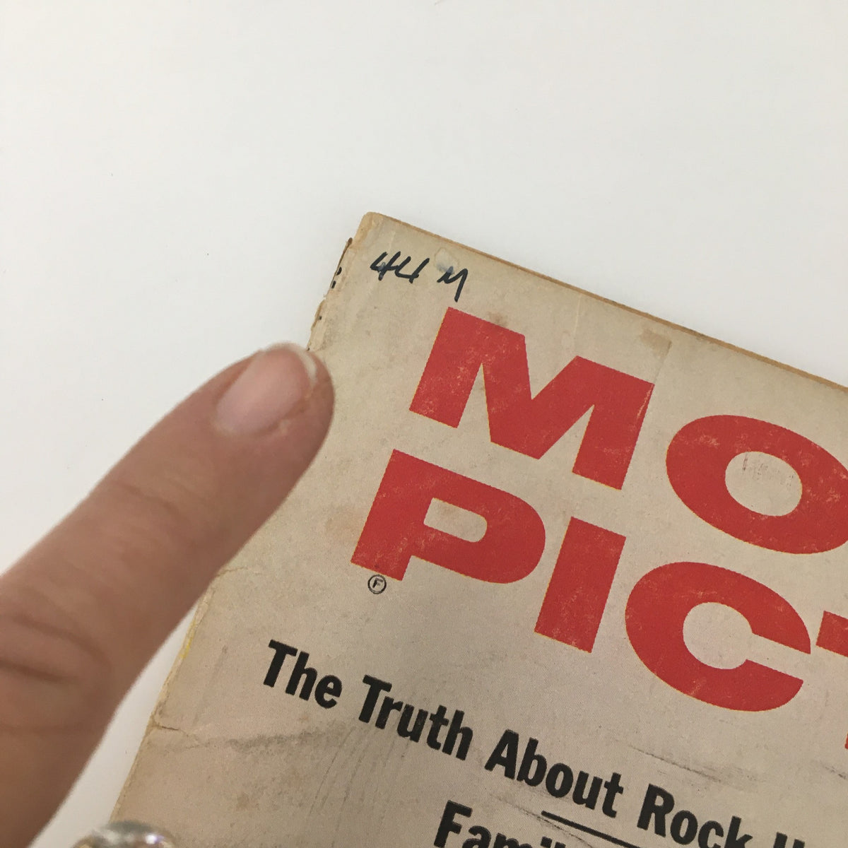 Back cover of VTG Motion Picture Magazine April 1959, displaying the title and a handwritten note, characteristic of vintage magazine condition.