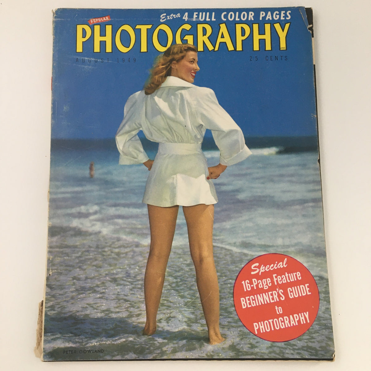Cover of VTG Popular Photography Magazine August 1949 featuring a woman in a white outfit by the beach, showcasing a Beginner's Guide to photography.