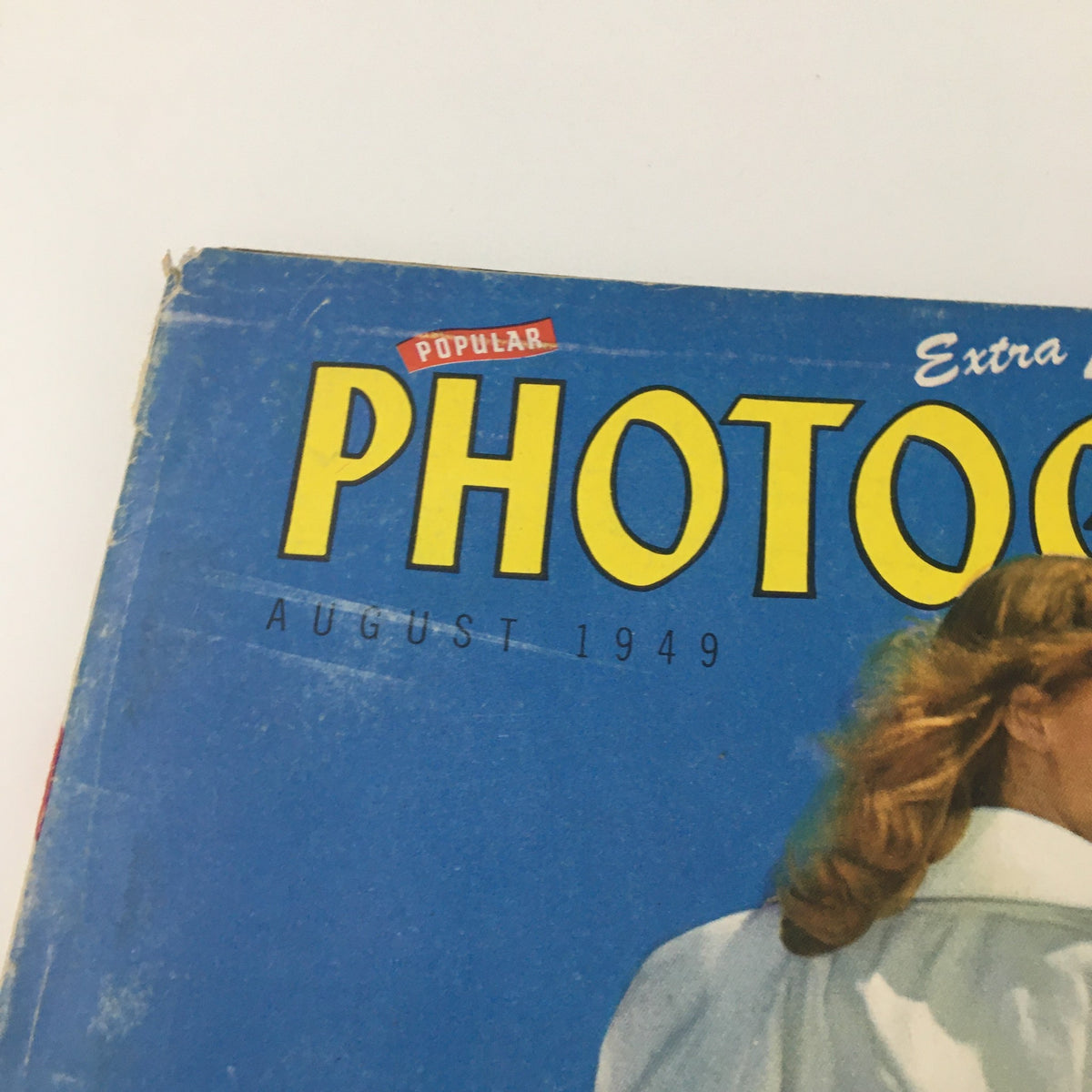 Close-up of the title of VTG Popular Photography Magazine August 1949, highlighting its vintage design and features.