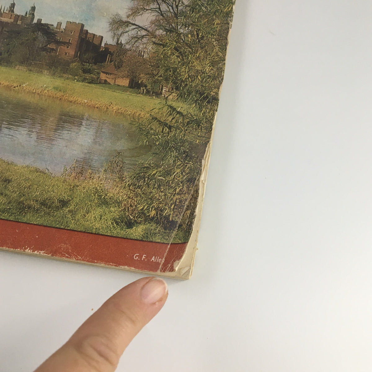 Close-up view of the lower section of the VTG Country Life Magazine from October 2, 1969, featuring the artist credit "G. F. Allen" and showcasing the picturesque backdrop.