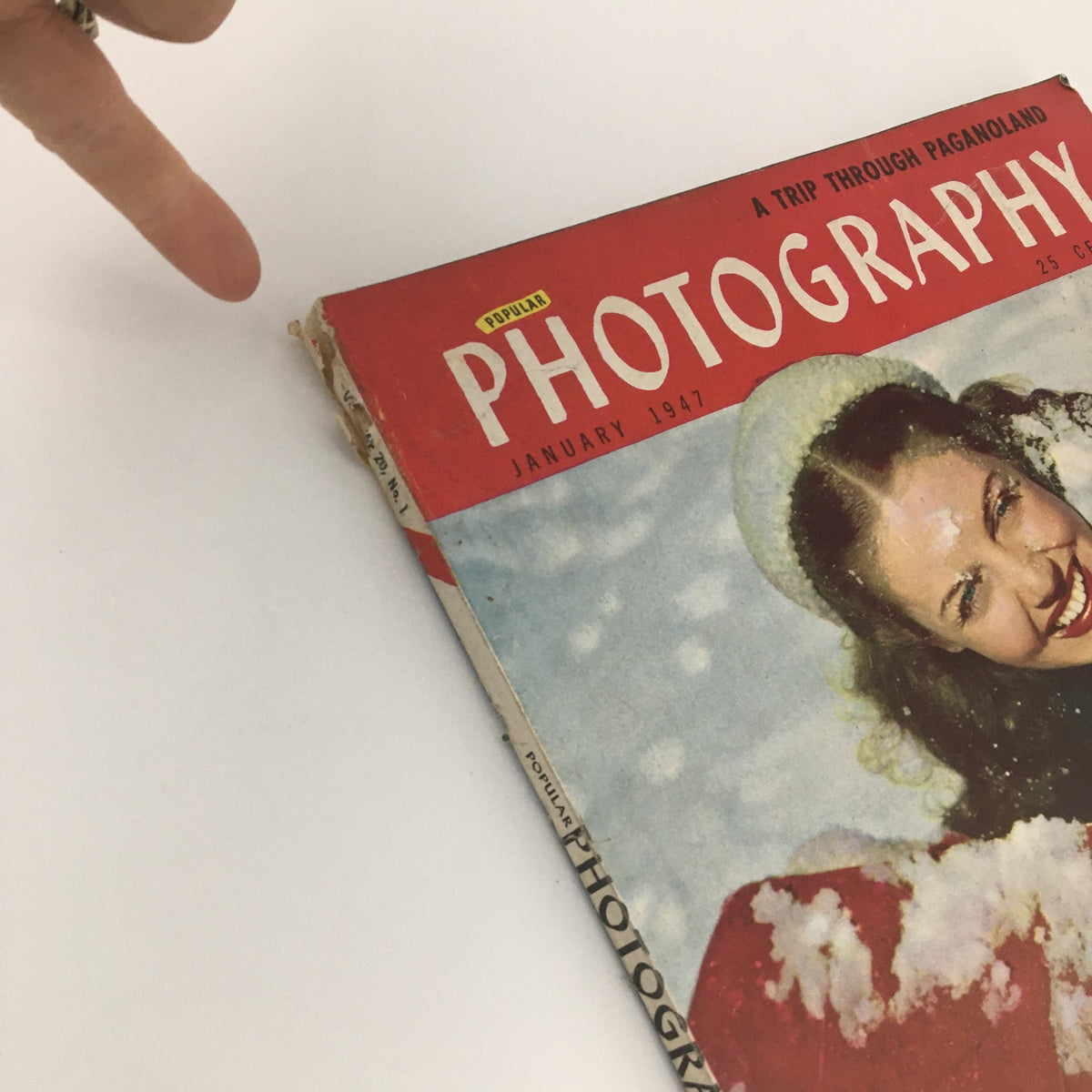 Cover of VTG Popular Photography Magazine January 1947 featuring an article 'A Trip Through Paganoland' with a vintage female portrait smiling in the snow.