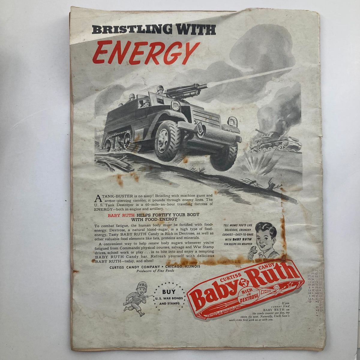 Vintage advertisement for Baby Ruth candy featured in VTG Model Builder Magazine, March 1943, Vol 7 #38, highlighting a military-themed illustration and promoting food energy during wartime.