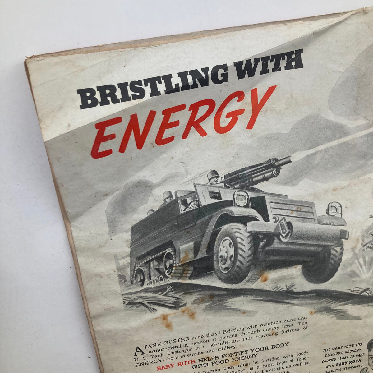 Close-up view of the Baby Ruth advertisement from VTG Model Builder Magazine, March 1943, Vol 7 #38, showcasing a tank and soldiers, emphasizing the historical context and design of the era.