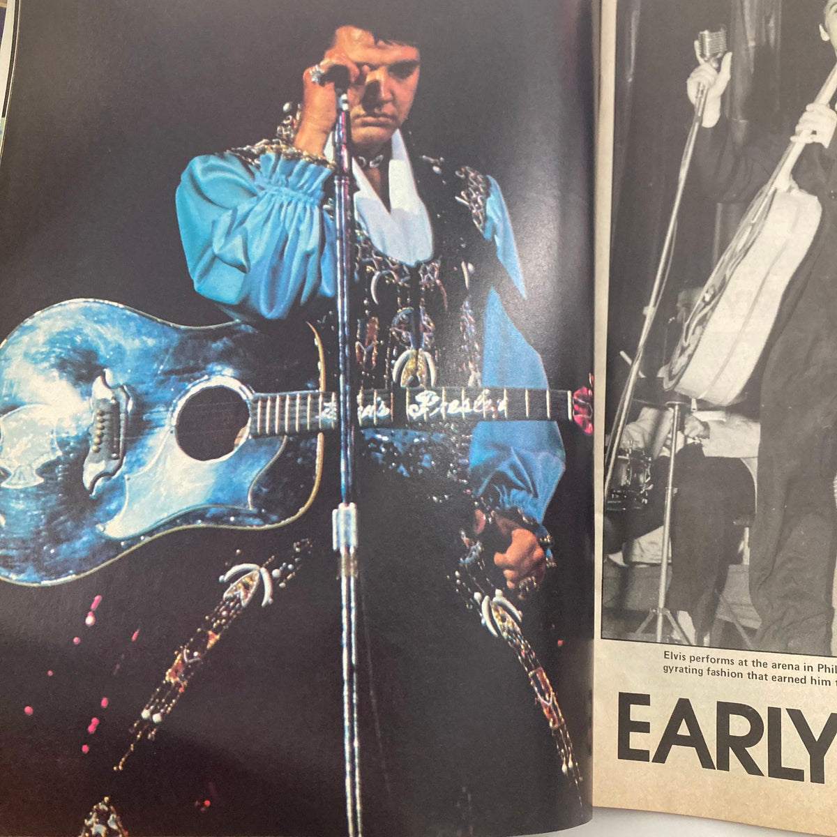 Close-up of Elvis Presley with his guitar during a performance, dressed in a striking outfit. This photograph is included in the collection titled 'VTG 1977 Elvis Forever A Salute to "The King" Elvis Presley No Label'.