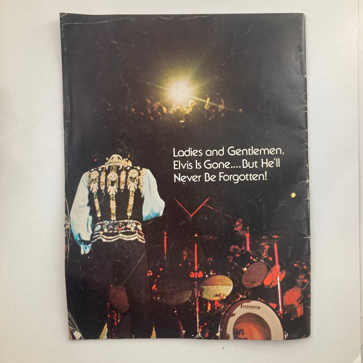 Back cover of a vintage magazine with the caption 'Ladies and Gentlemen, Elvis is Gone.... but He'll Never Be Forgotten!', honoring the legacy of Elvis Presley. This cover is part of the collection titled 'VTG 1977 Elvis Forever A Salute to "The King" Elvis Presley No Label'.