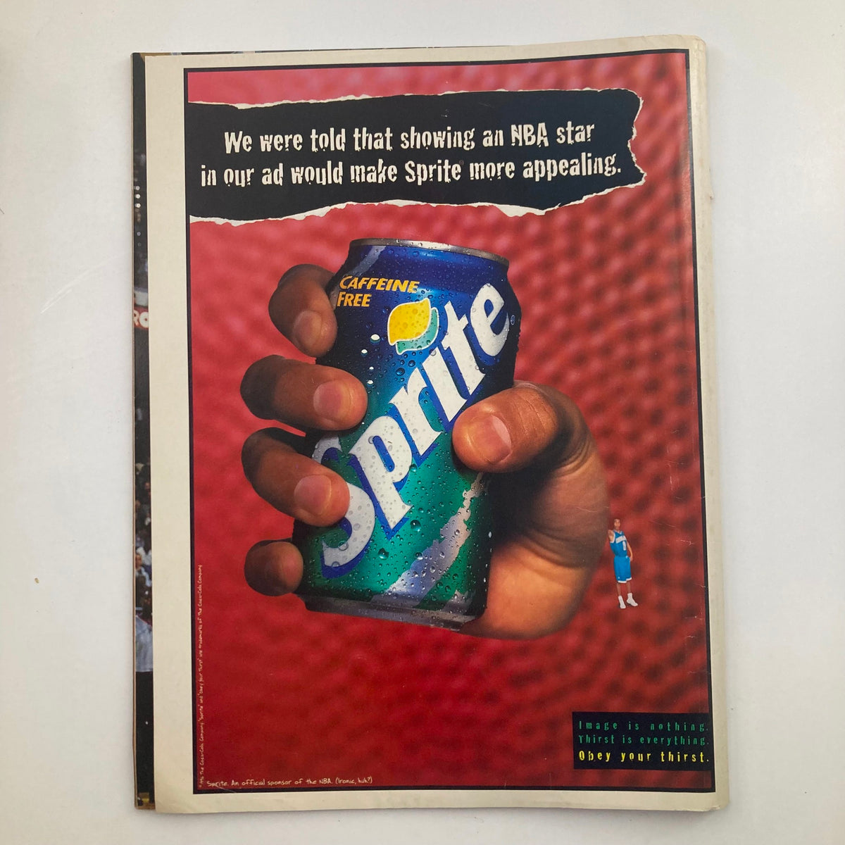 Full-page advertisement from NBA Inside Stuff Magazine May 1997 Vol 6 No. 3 featuring a hand holding a Sprite can with the tagline about using an NBA star in their ad, highlighting Sprite's appeal.