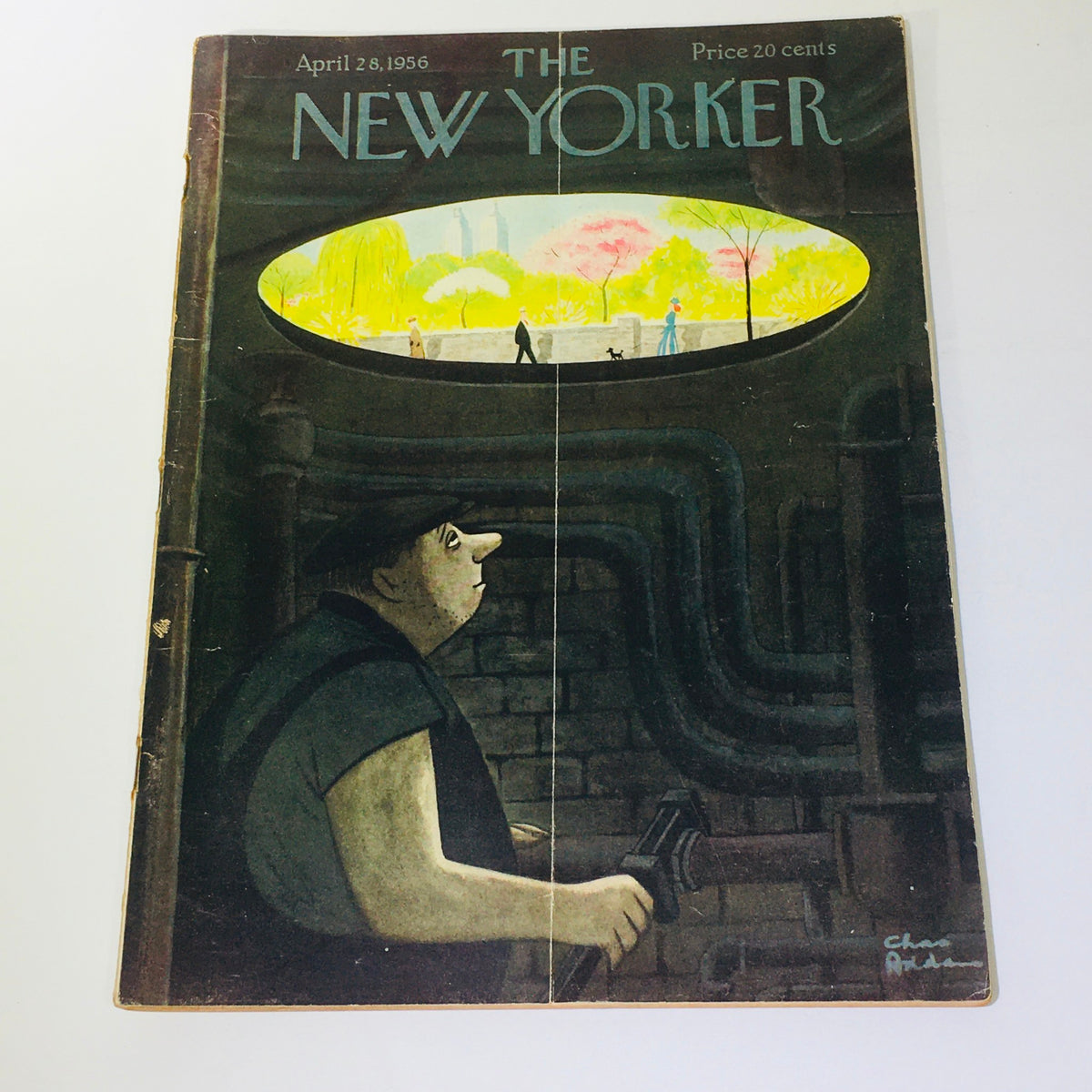 Cover of The New Yorker, April 28, 1956, featuring a unique illustration by Chas Addams, showcasing a character in a dimly lit setting looking towards a bright park scene above.