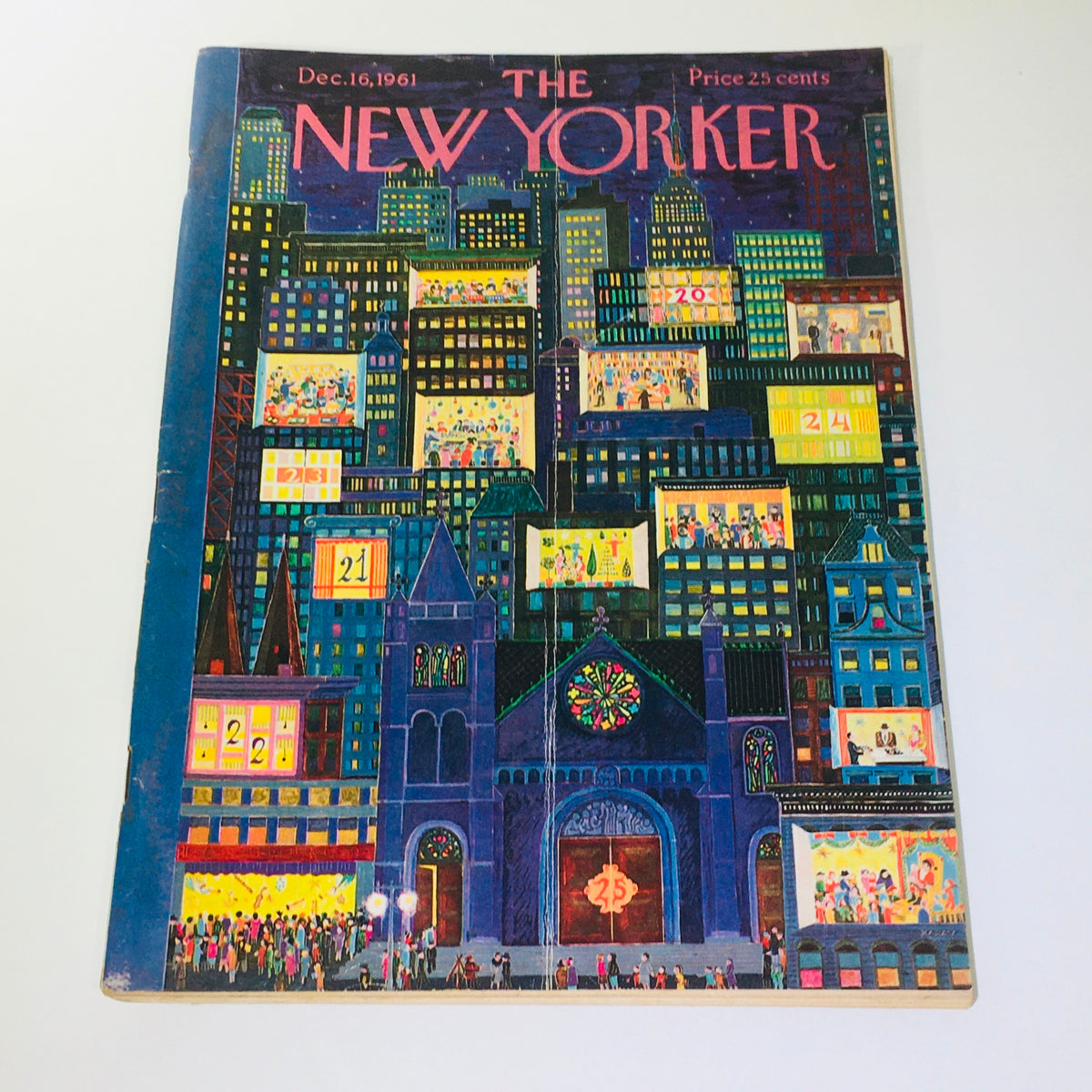 The New Yorker: Dec 16 1961 - Full Magazine with a colorful cityscape cover by Ilonka Karasz, featuring festive scenes and advertisements on buildings.