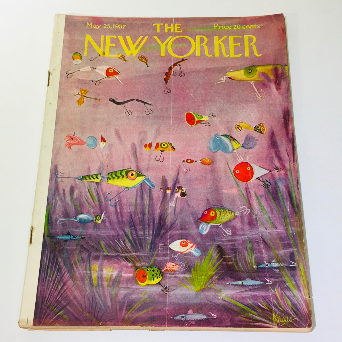 The New Yorker Magazine May 25, 1957 features a vibrant cover illustration by Peter Arno, showcasing colorful fishing lures in an underwater setting. This iconic vintage magazine cover captures the artistic spirit of mid-20th-century America.