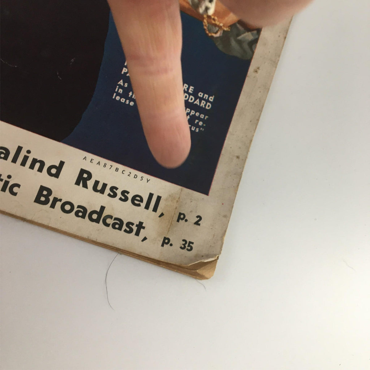 Detail shot of the edge of the VTG Movie Radio Guide Programs November December 1938, showcasing wear and age marks, emphasizing its historical significance for movie memorabilia collectors.
