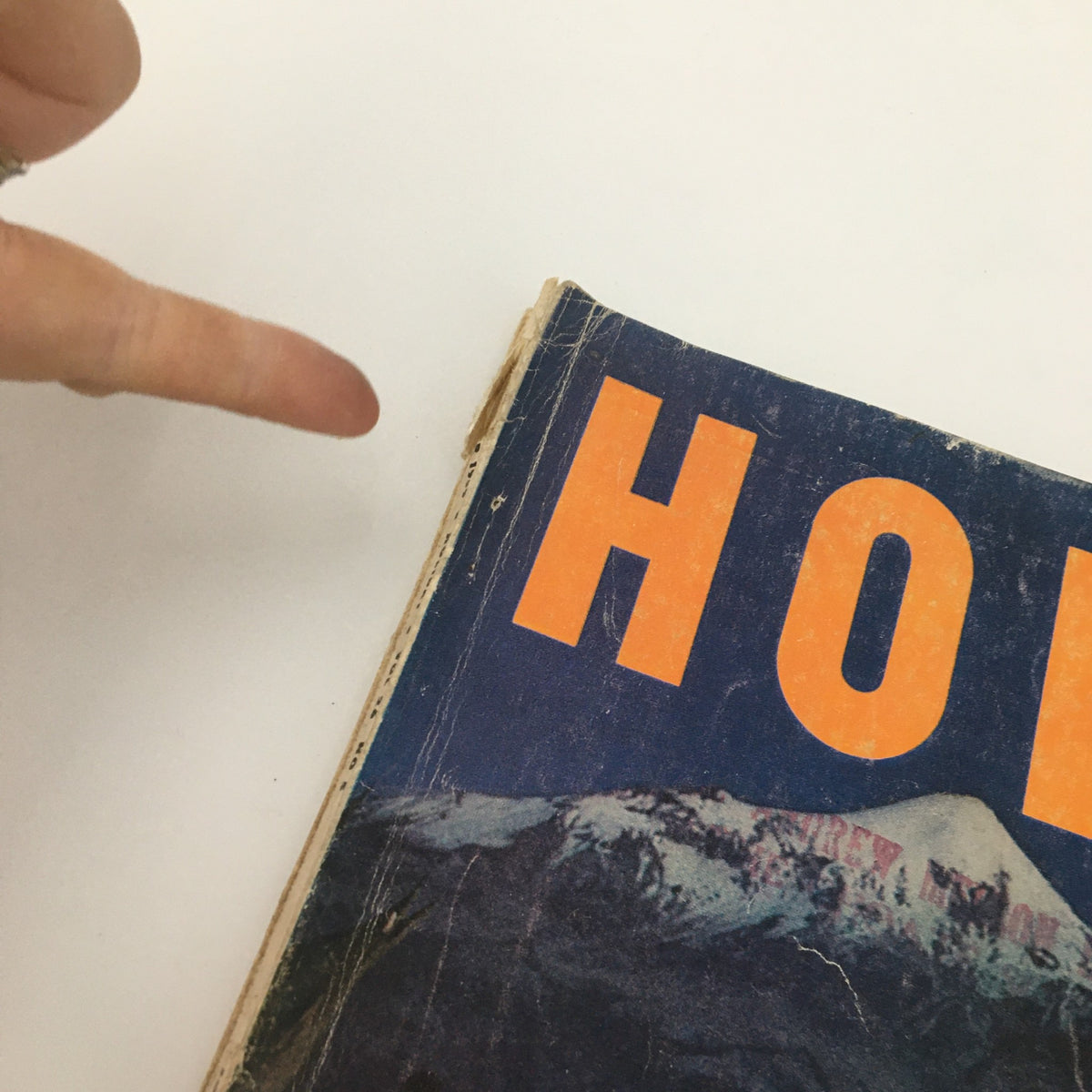 Detail of the VTG Holiday Magazine November 1959 cover, focusing on the title 'HOLIDAY' with visible wear.