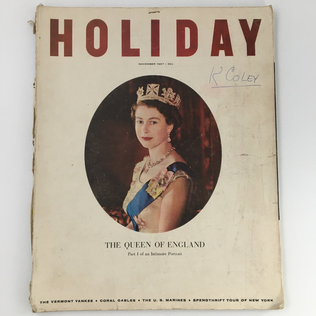 VTG Holiday Magazine November 1957 Queen Elizabeth Cover featuring a portrait of Queen Elizabeth wearing a tiara and a sash. Vintage magazine showcasing 1950s culture.