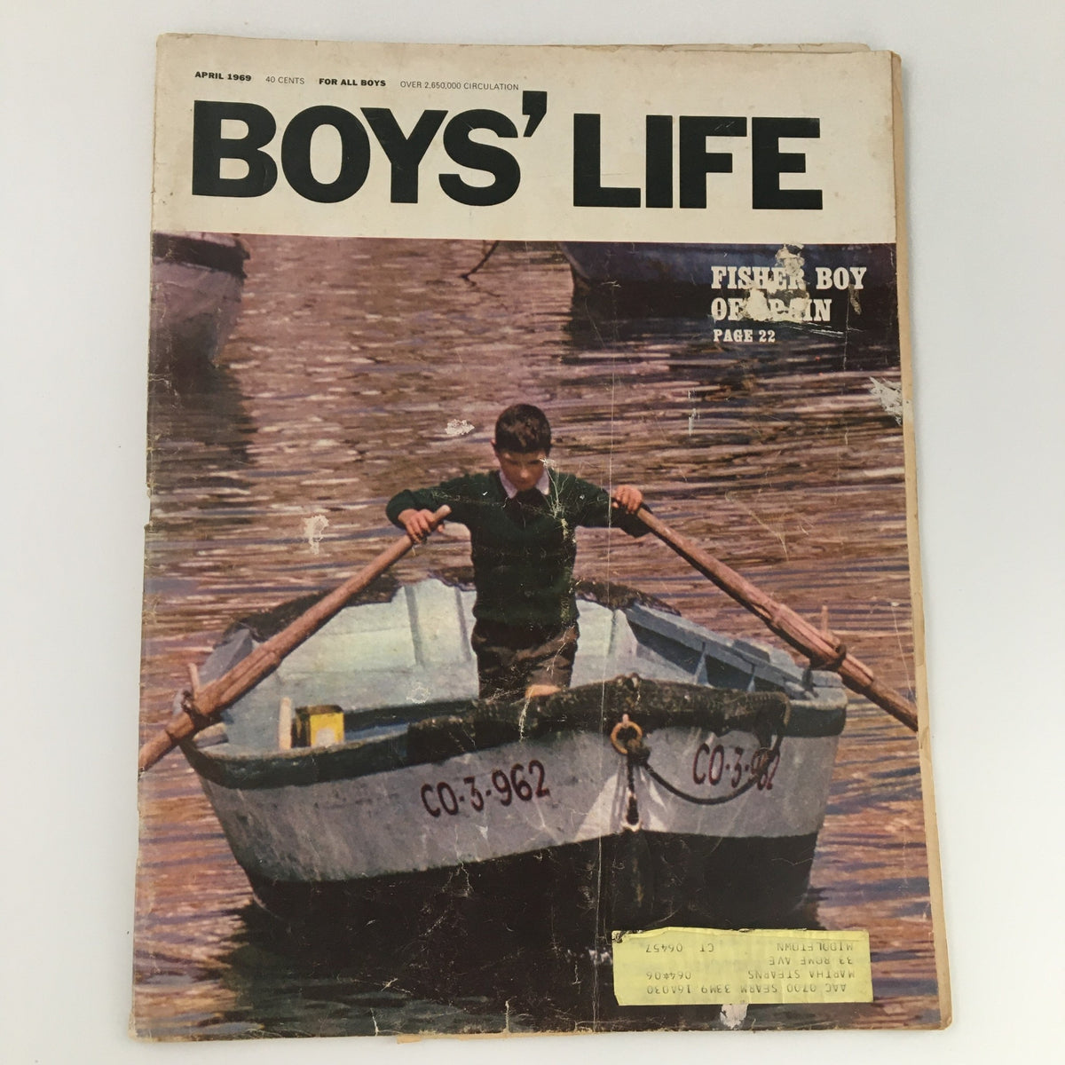 Cover of the April 1969 issue of Boys' Life Magazine featuring a Fisher Boy orphan, with a young boy rowing a boat on calm waters, showcasing vintage design and nostalgic charm.