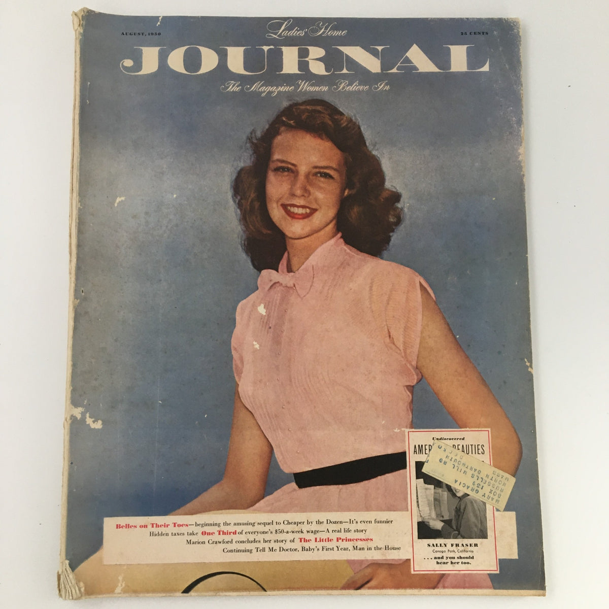 VTG Ladies' Home Journal Magazine August 1950 cover featuring a smiling woman in a pink blouse against a blue background, highlighting the nostalgic design of the 1950s.