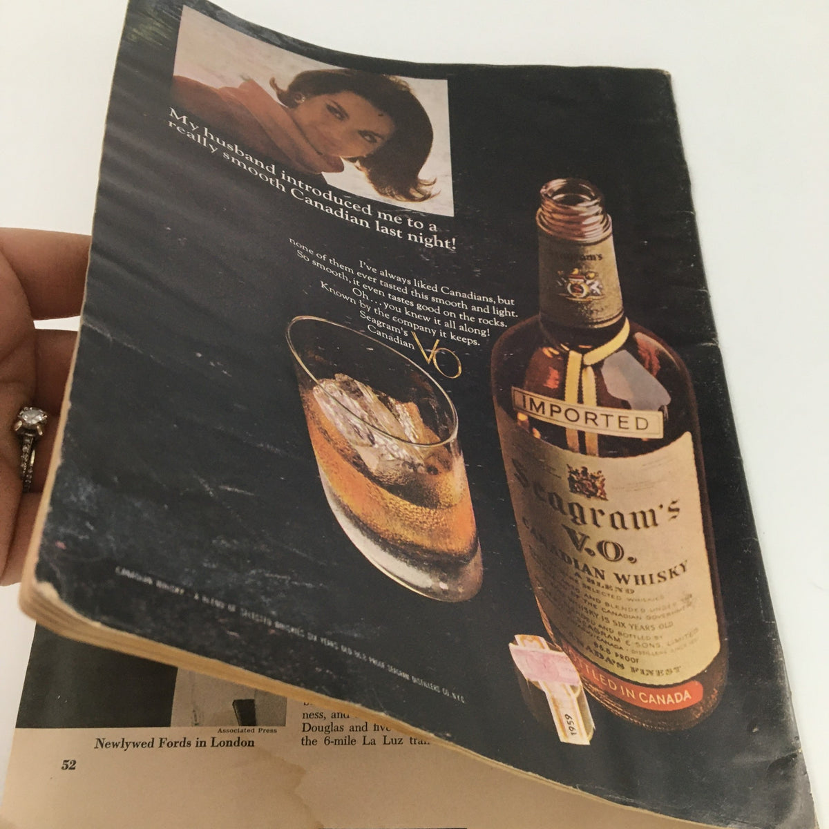 Close-up of an advertisement from VTG Newsweek Magazine March 1 1965 featuring Seagram's V.O. Canadian Whisky and a glass of whisky. This vintage magazine showcases nostalgic advertising elements from the 1960s.