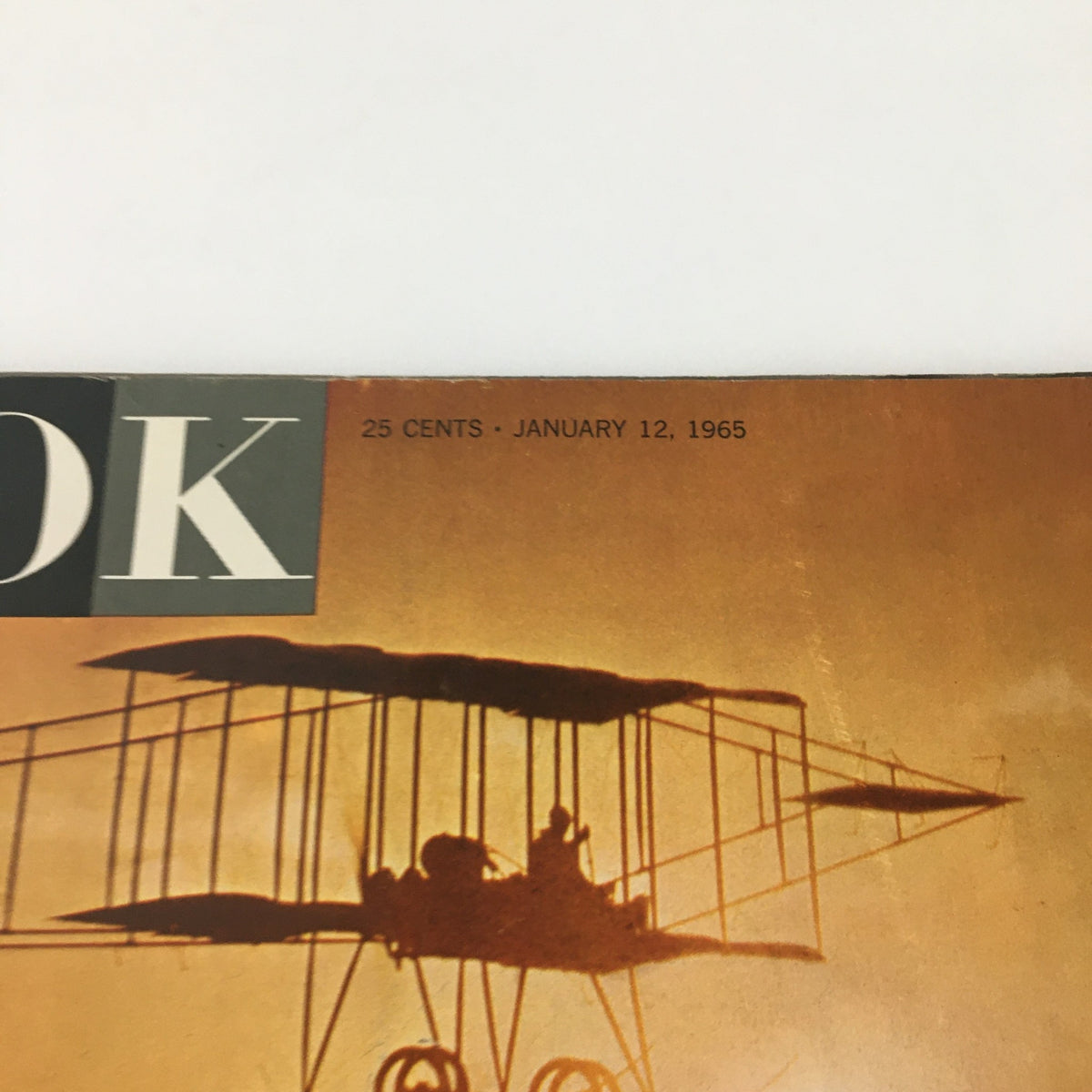 Close-up of the VTG Look Magazine January 12, 1965 cover highlighting the silhouette of an airplane against an orange backdrop, indicative of the magazine's focus on the Twentieth Century.