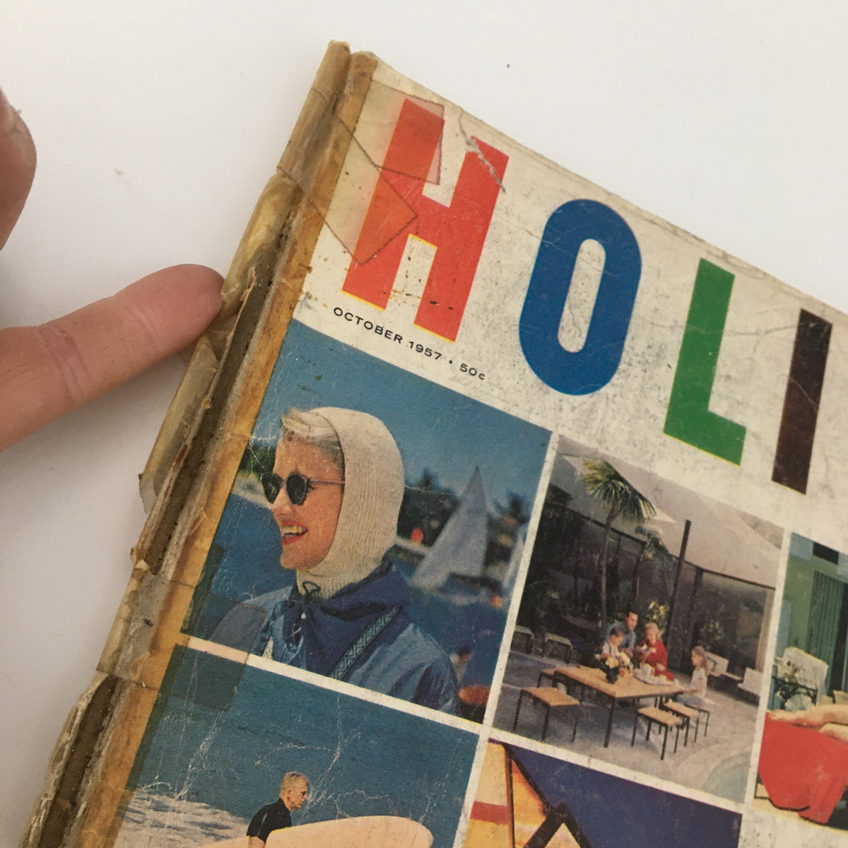 Close-up view of the cover of the VTG Holiday Magazine October 1957, showcasing the title 'The Astounding World of Los Angeles' with vibrant colors and a nostalgic design.
