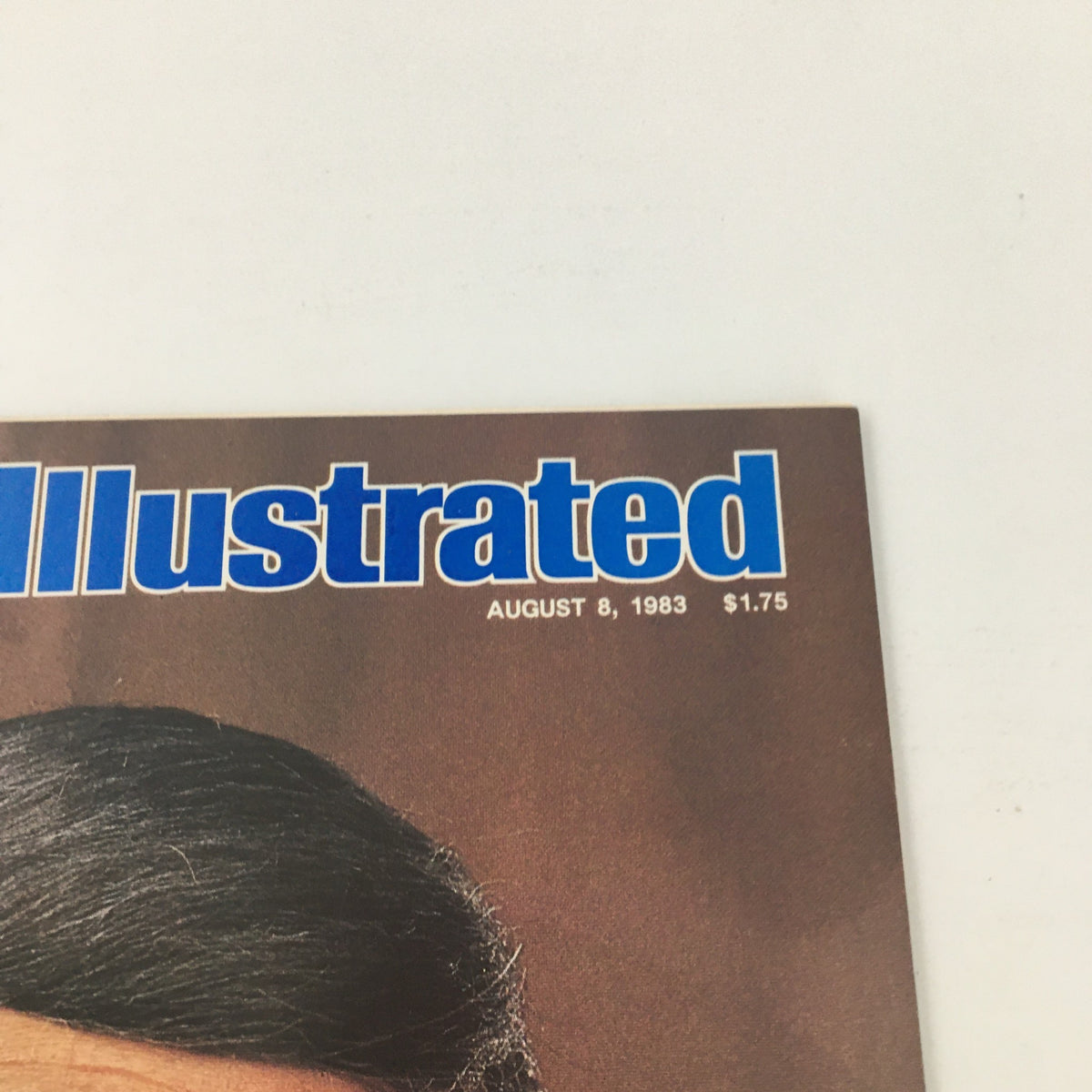 Close-up shot of the Sports Illustrated Magazine cover with date August 8, 1983. Features the title prominently along with the iconic image of Howard Cosell.