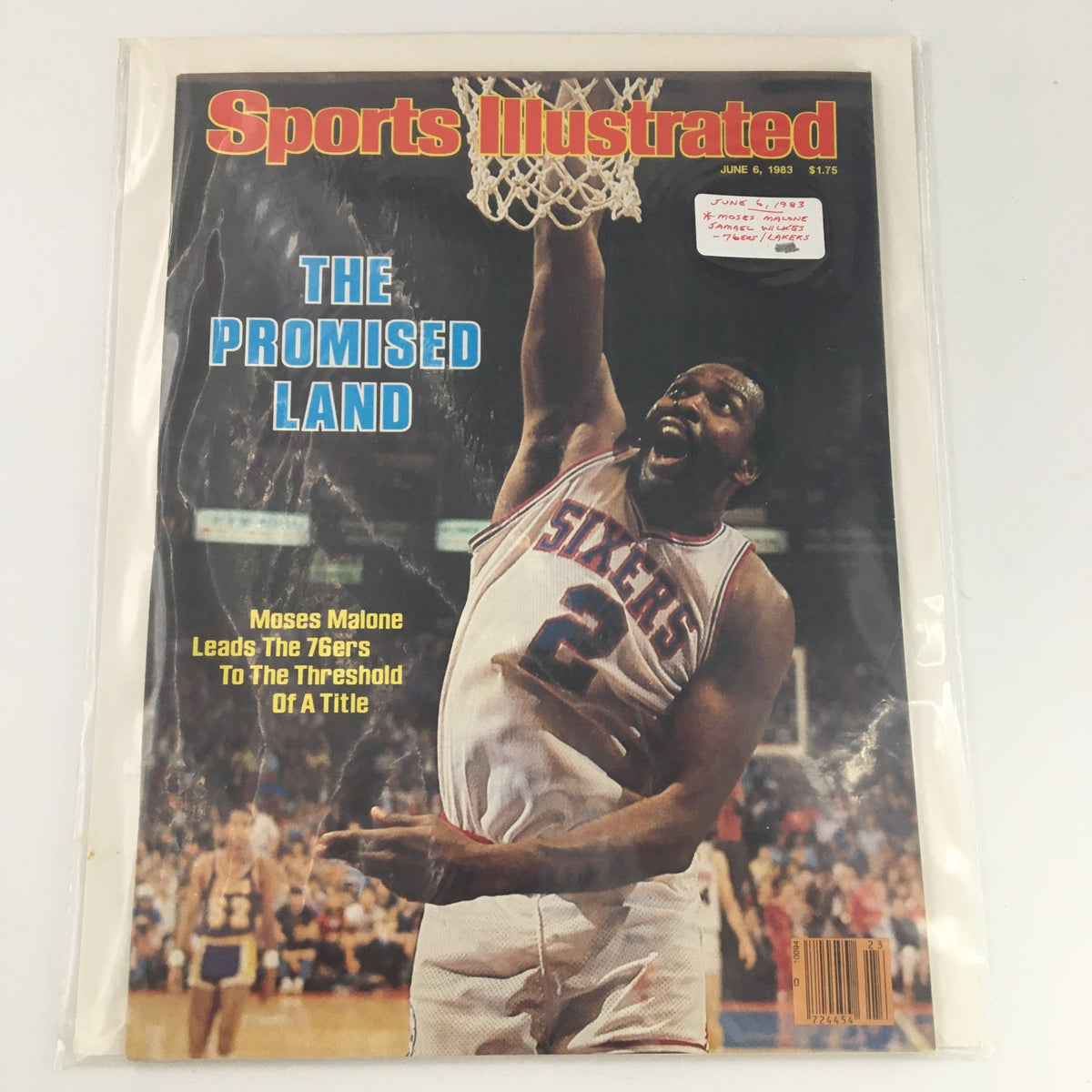 Front cover of the Sports Illustrated magazine from June 6, 1983, featuring NBA superstar Moses Malone in action and the headline 'The Promised Land,' celebrating his achievements with the Philadelphia 76ers.