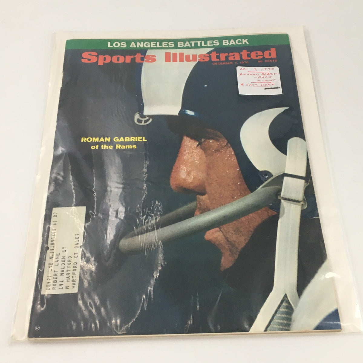 Vintage Sports Illustrated magazine in protective sleeve, featuring Roman Gabriel of the Rams on the cover, emphasizing its collectible nature.