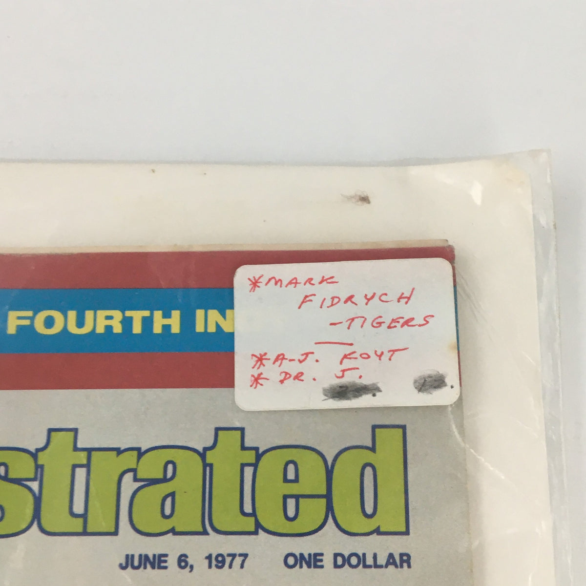 Close-up view of the cover of the vintage Sports Illustrated magazine from June 6, 1977, featuring MLB Pitcher Mark Fidrych, with a handwritten address label noting 'Mark Fidrych - Tigers' at the top.