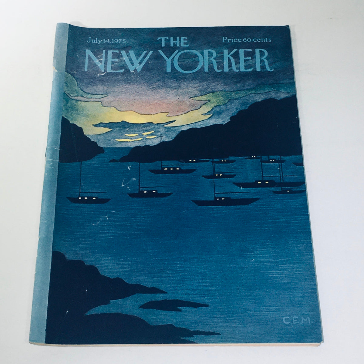 Cover of The New Yorker Magazine from July 14, 1975, illustrating the serene scene of boats docked at night, created by artist Charles E. Martin.