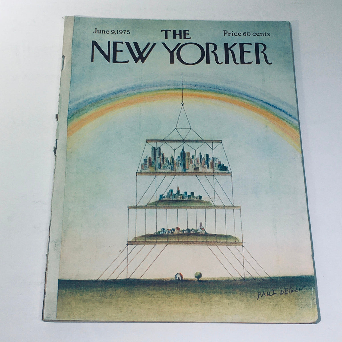 Vintage magazine cover of The New Yorker dated June 9, 1975, featuring artwork by Paul Degen, depicting layered landscapes and cityscapes under a rainbow.