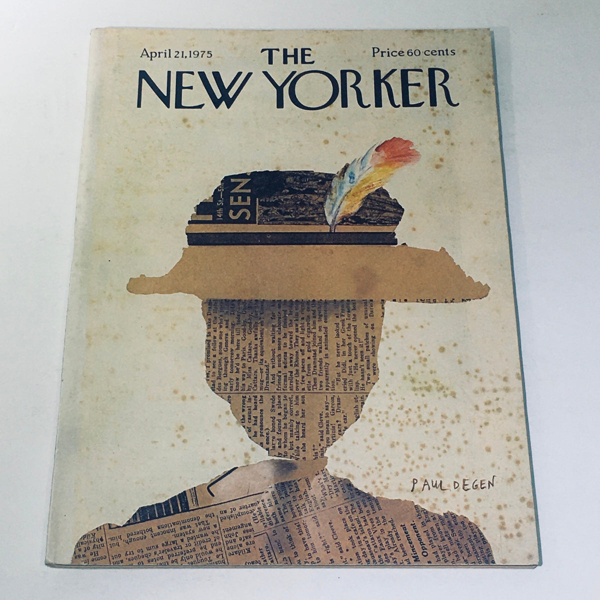 Cover of The New Yorker Magazine from April 21, 1975, featuring artistic design by Paul Degen, showcasing a silhouette with a newspaper-themed hat and a feather.
