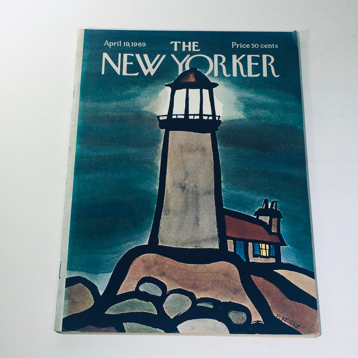 Cover of The New Yorker Magazine dated April 19, 1969, featuring a lighthouse illustration by Donald Reilly, showcasing charming artwork against a moody background, priced at 50 cents.