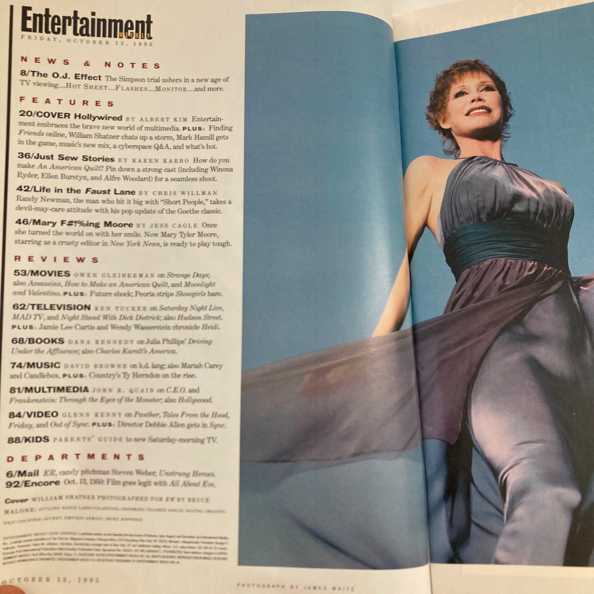 Interior view of Entertainment Weekly Magazine dated October 13, 1995, featuring an article about William Shatner. The magazine includes headlines and a stylish photo shoot with a model wearing a flowing dress, showcasing the magazine's design and content related to entertainment news.
