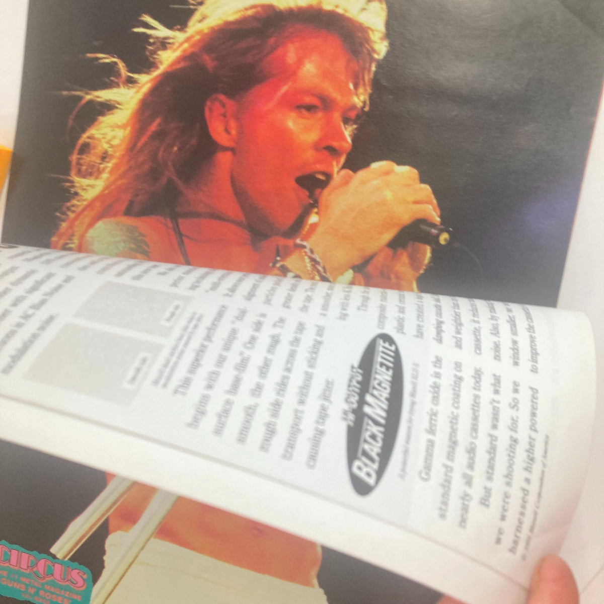 Close-up image of Axl Rose performing, as featured in Circus Magazine October 31, 1991, highlighting the energy and iconic style of the rock legend.