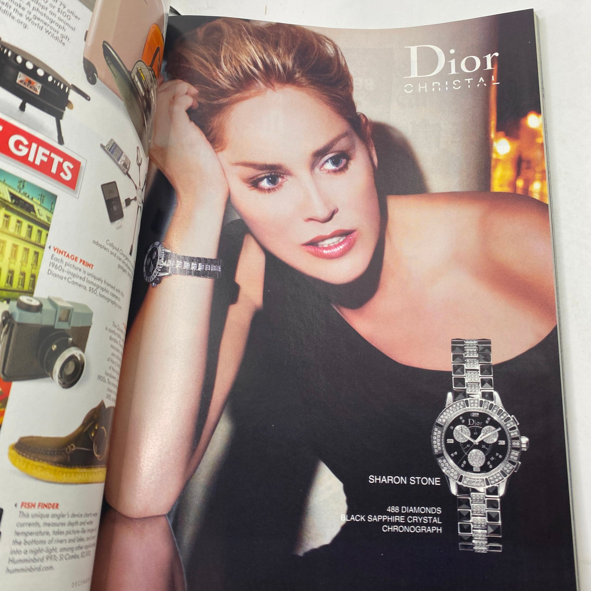 Advertisement page from Vanity Fair Magazine December 2007 featuring Sharon Stone modeling a luxury Dior watch, emphasizing the magazine's focus on celebrity culture.