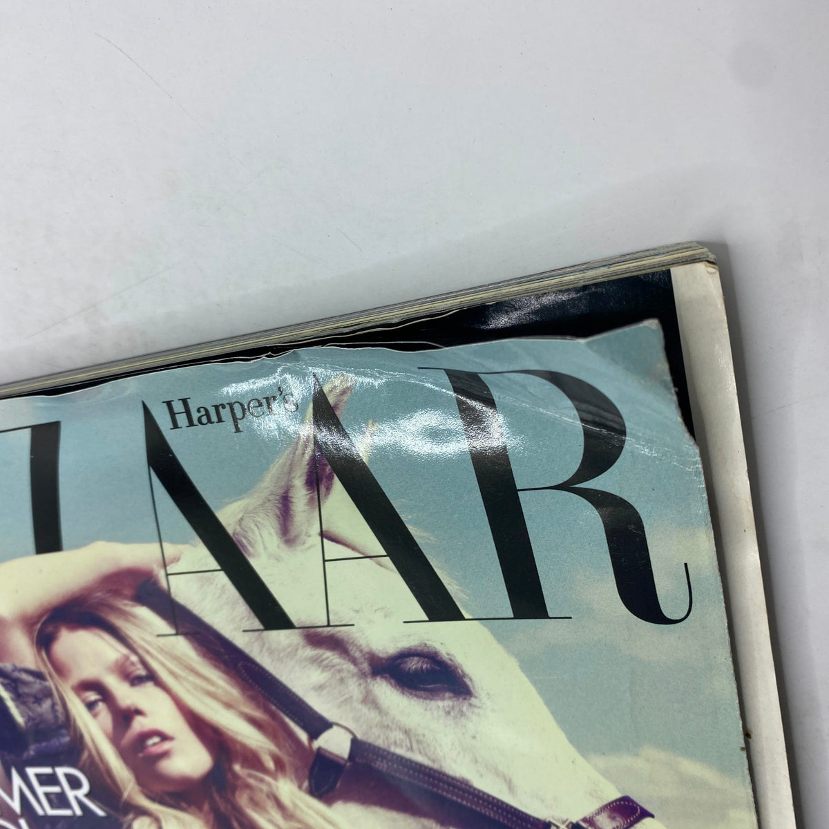 Cover of Harper's Bazaar UK Magazine July 2008 featuring model Masha Novoselova with a partially visible horse. Vintage fashion magazine for collectors.